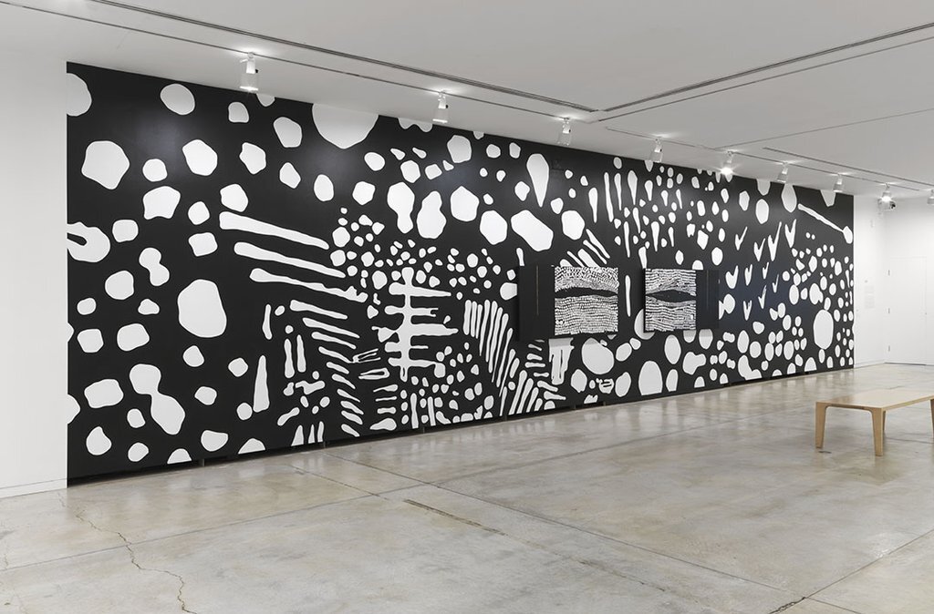 Black and white hand painted mural of pattern and linework